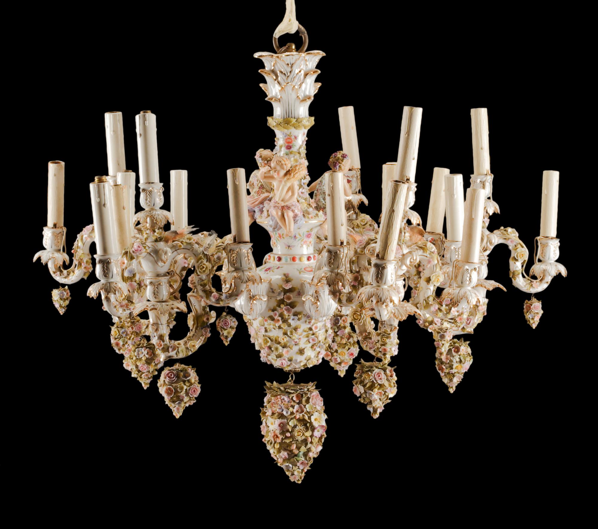 A German Porcelain Twenty-Light Chandelier Height 25 x diameter 32 inches.