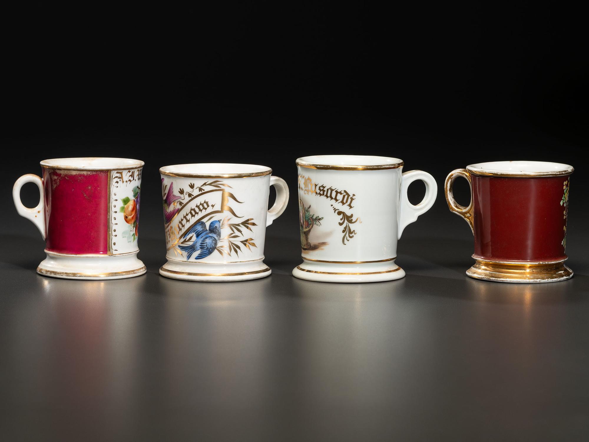 Four Porcelain Shaving Mugs with Fruit and Floral Decoration