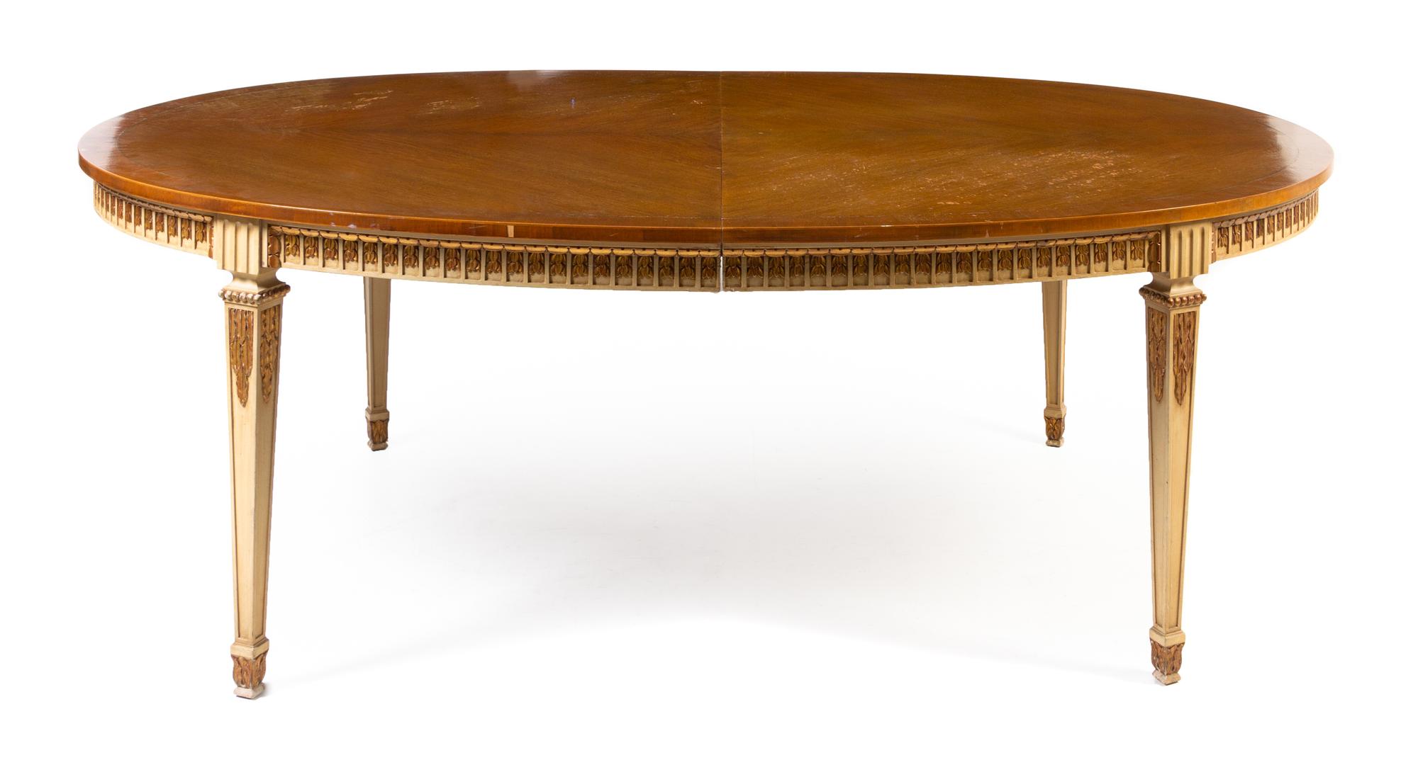 A Louis XVI Style Painted and Parcel Gilt Extension Dining Table Height 29 3/4 x width 84 x depth 54 1/4 inches. — MID-20TH CENTURY