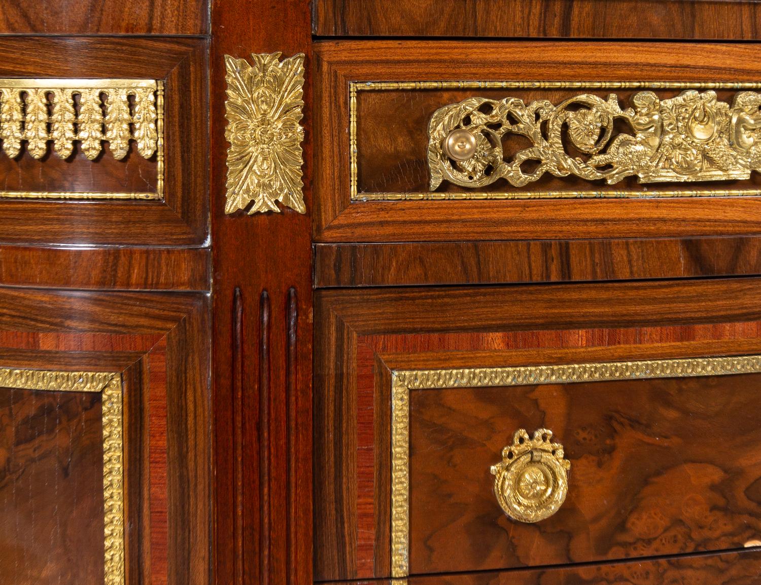 A Louis XVI Style Gilt Bronze Mounted Chest of Drawers