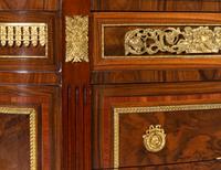 A Louis XVI Style Gilt Bronze Mounted Chest of Drawers