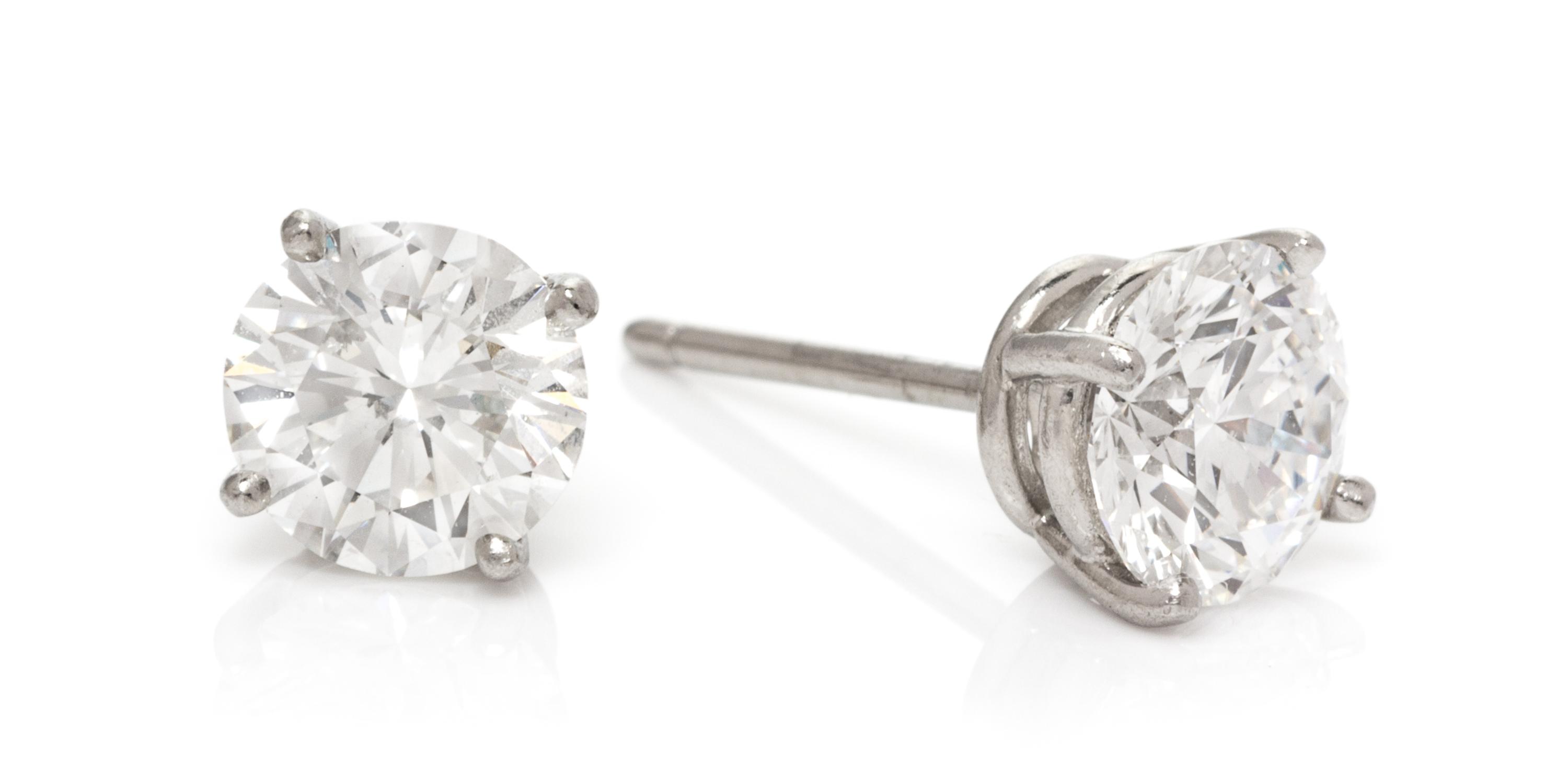 A Pair of Platinum and Diamond Studs, Tiffany & Co., 1.80 dwts.