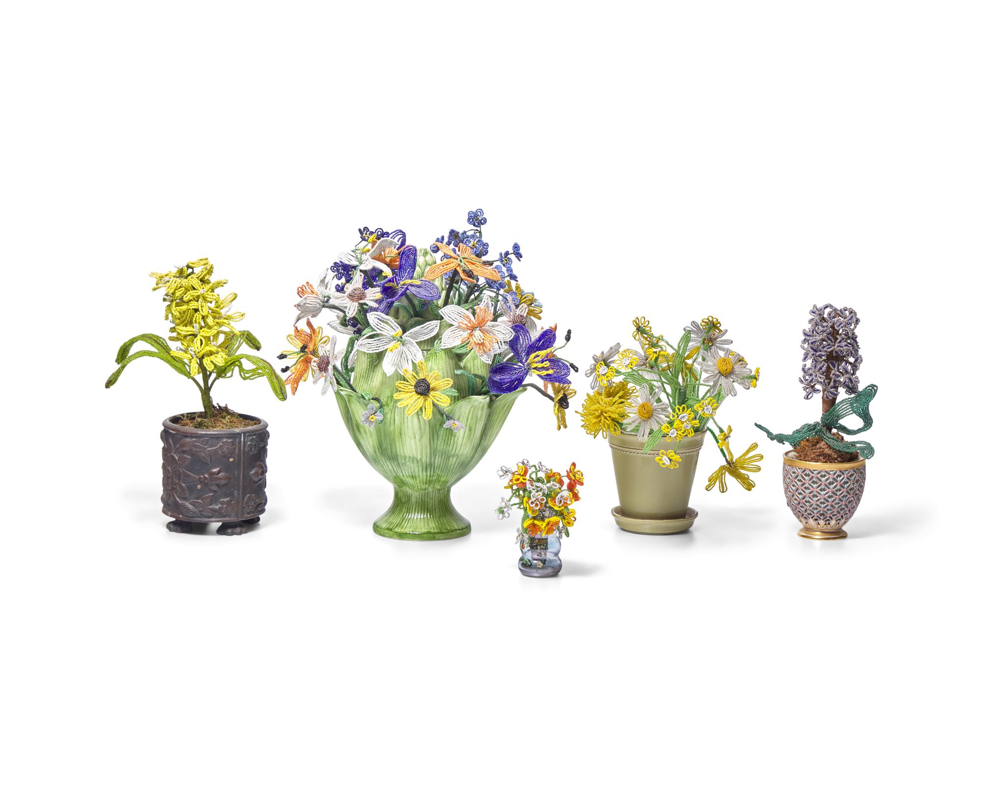 A Collection of Twenty-One French Beaded and Glass Flower and Fruit Arrangements