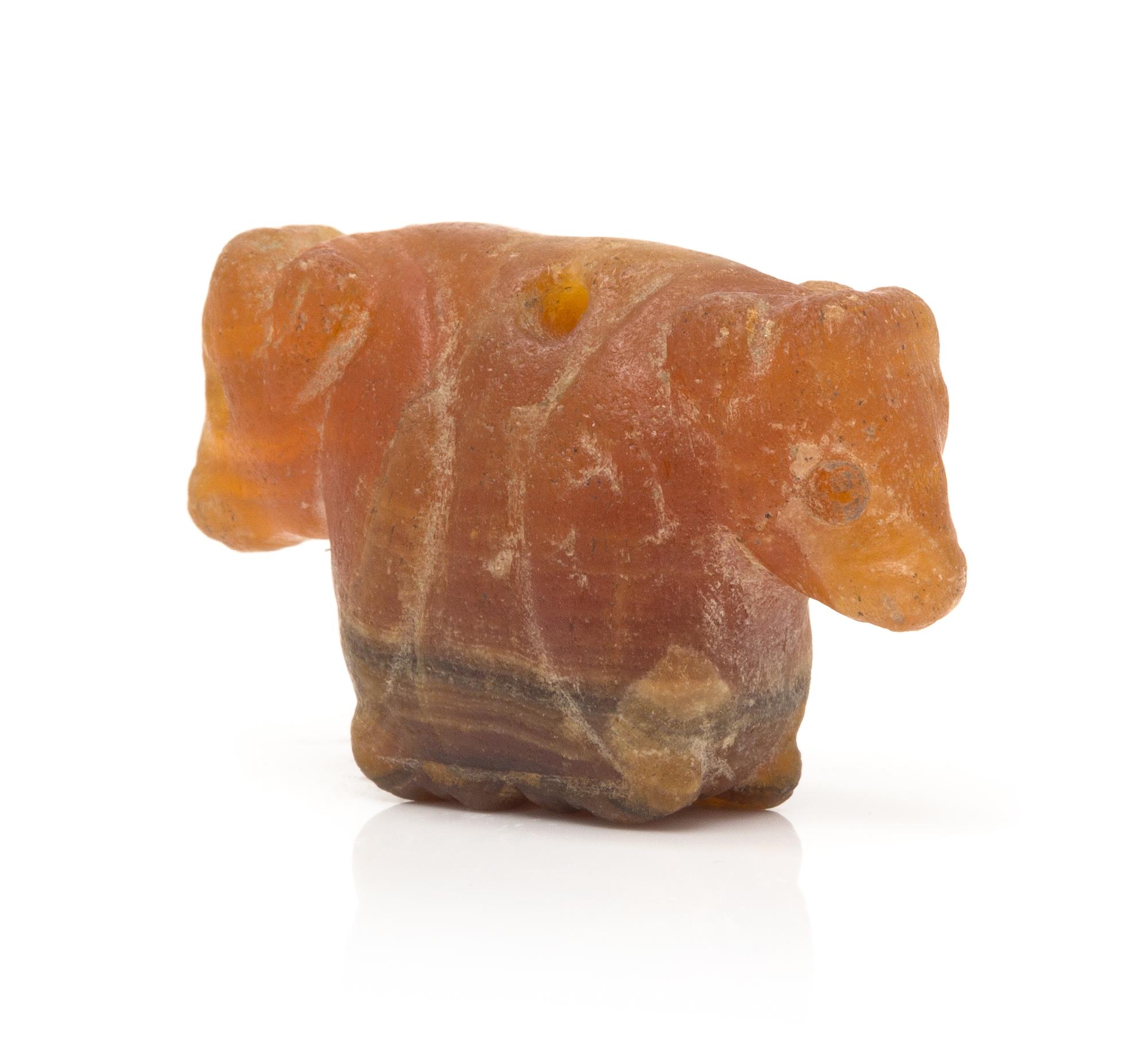 A Possibly Ancient Carnelian Double Calf Carved Bead, 11.00 dwts.