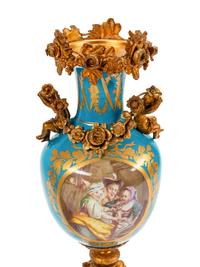 A Pair of Sèvres Style Gilt Bronze Mounted Porcelain Urns