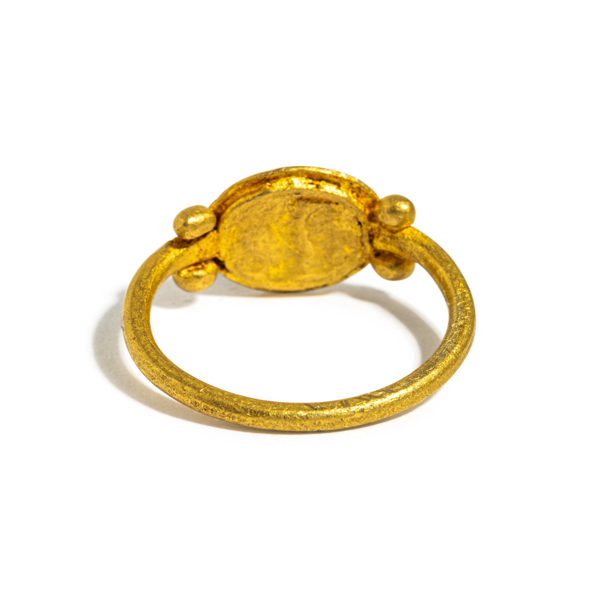 A Roman Gold and Garnet Finger Ring with the Goddess Minerva
