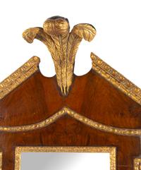 A George III Style Carved and Parcel Gilt Mahogany Prince of Wales Feather Decorated Mirror