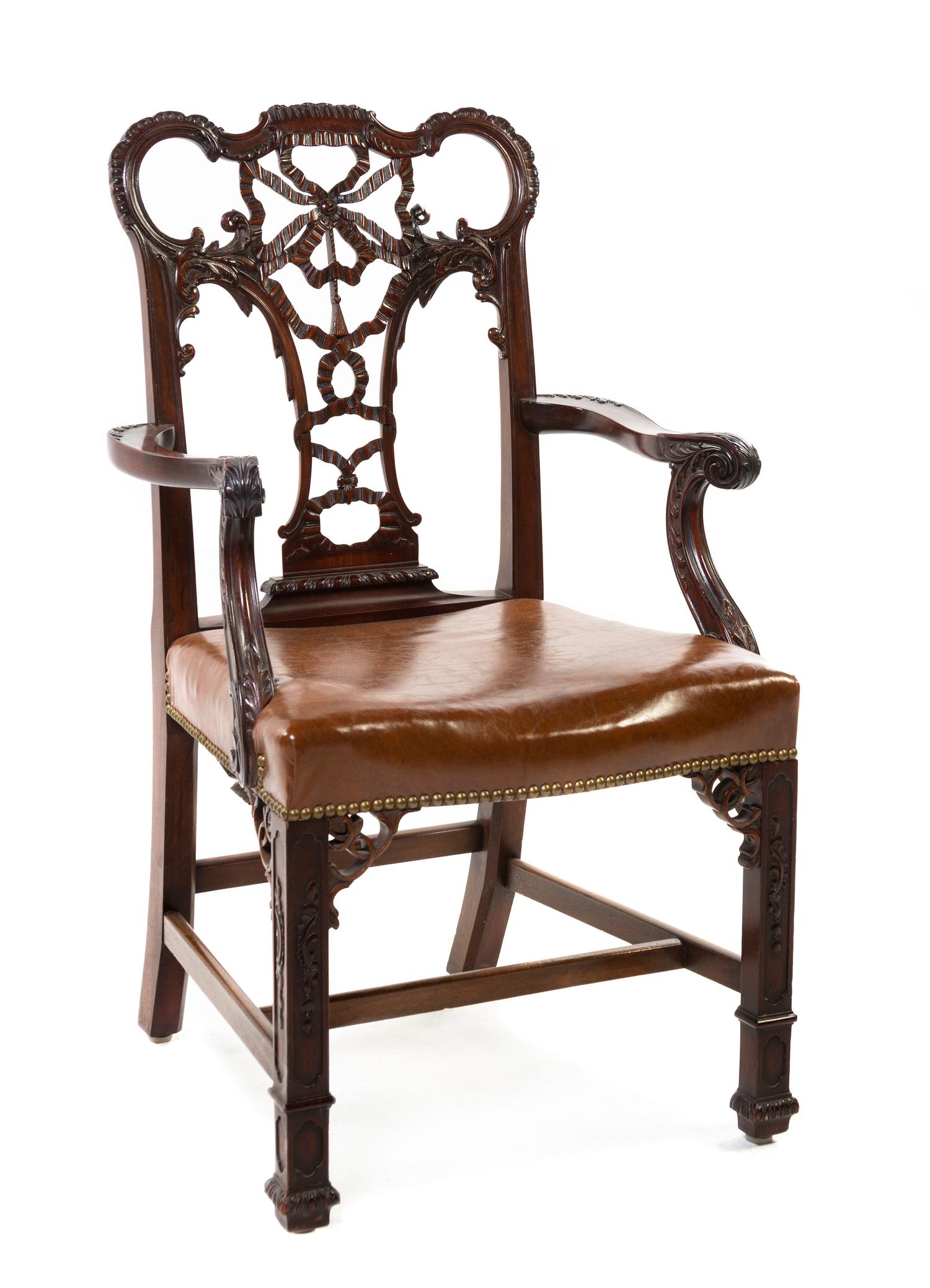 A Set of Fourteen Chippendale Style Mahogany Dining Chairs, Height 40 1/2 inches.