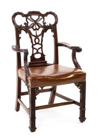 A Set of Fourteen Chippendale Style Mahogany Dining Chairs, Height 40 1/2 inches.