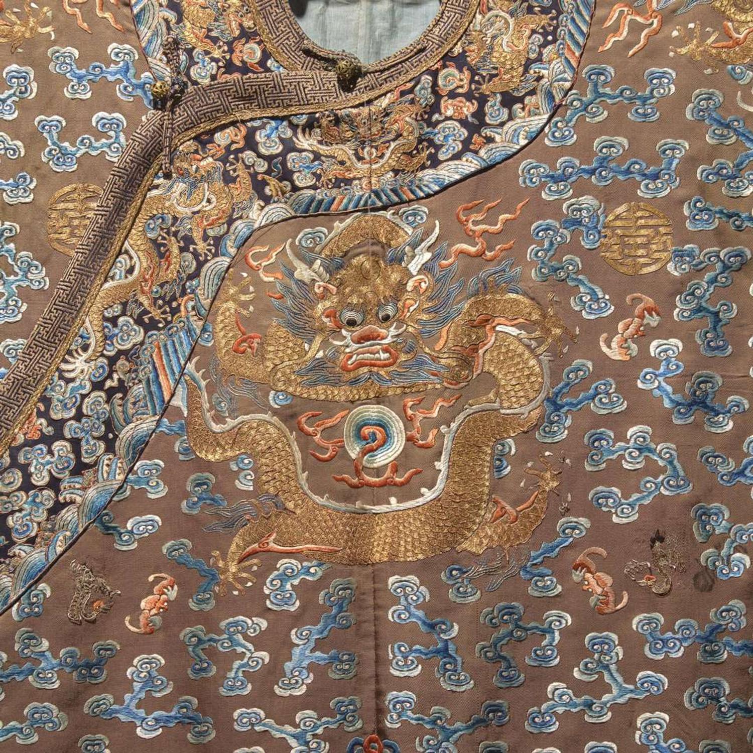 A Chinese embroidered brown silk “Dragon” court robe 刺绣龙袍 Qing dynasty, 19th century ? ????