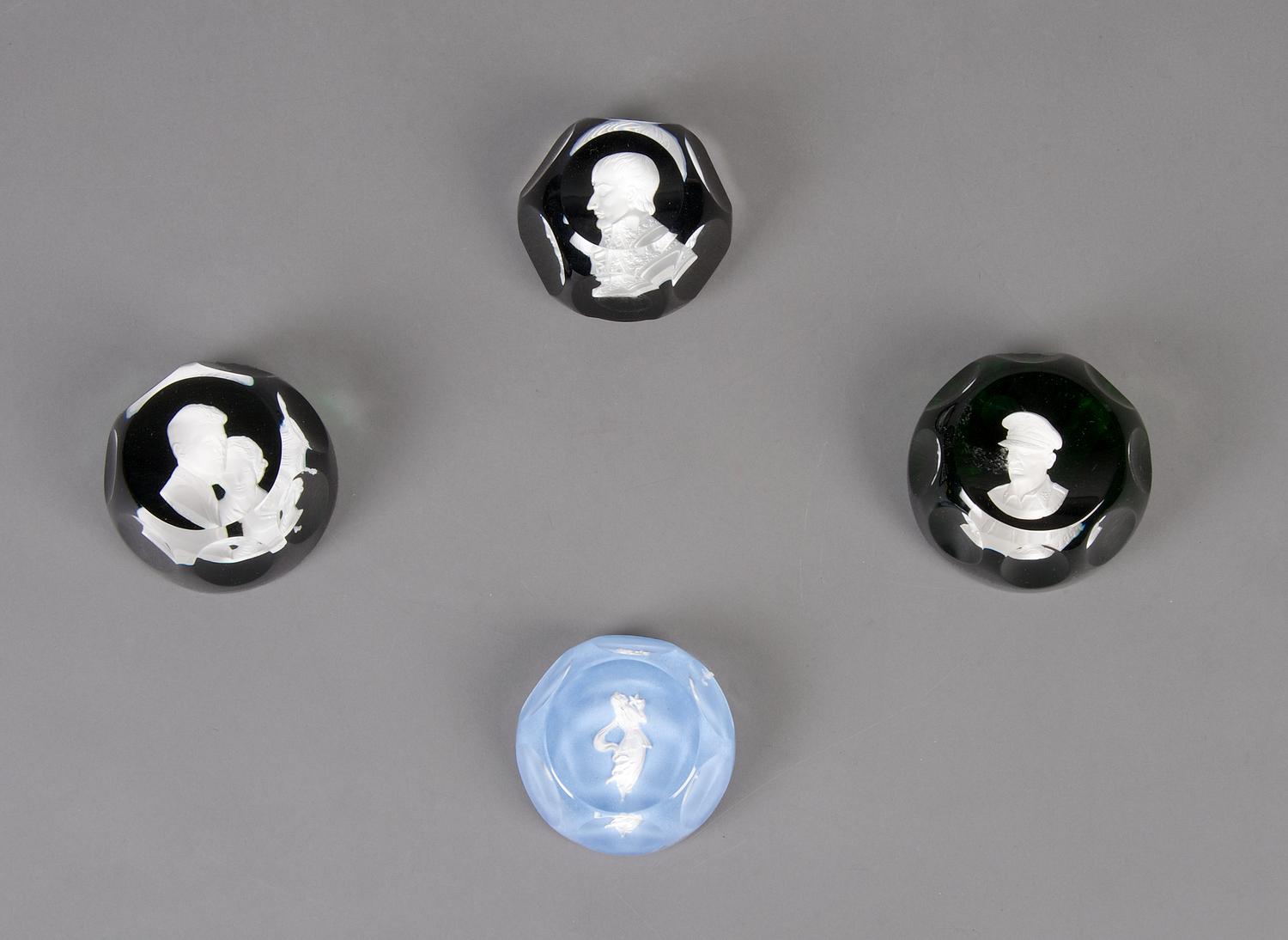 A Collection of Four Sulfide Paperweights, Width of widest 2 7/8 inches.