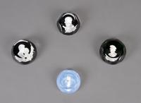 A Collection of Four Sulfide Paperweights, Width of widest 2 7/8 inches.