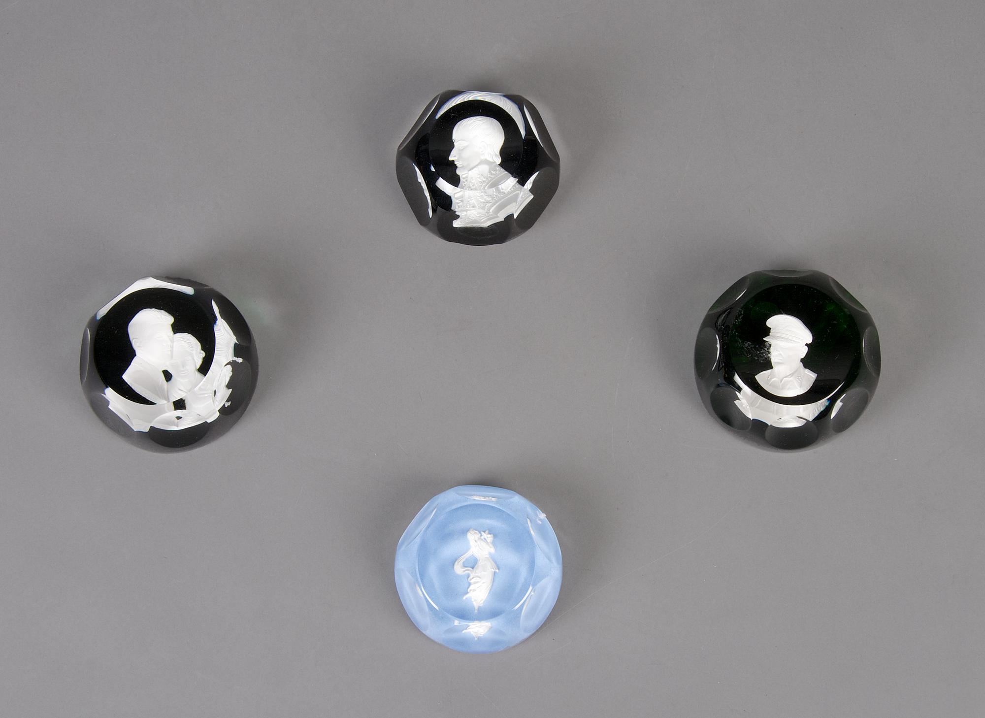 A Collection of Four Sulfide Paperweights, Width of widest 2 7/8 inches.