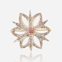 A 10K Rose Gold, Diamond, and Ruby Brooch