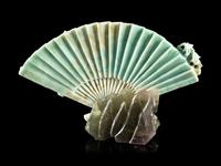 A Chinese Apple Green and Celadon Jadeite Fan-Form Carving