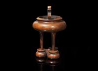 A Chinese patinated copper alloy tripod censer and stand, apocryphal "Xuan" mark 銅爐及底座 宣款