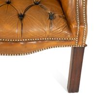 An English Button-Tufted Leather Armchair