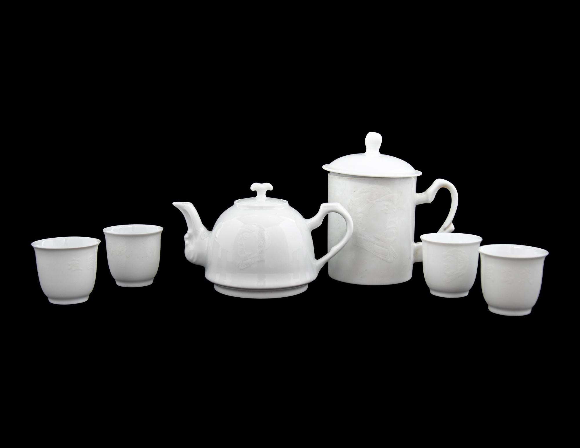 A Set of White Glazed Porcelain Teapot and Tea Cups and A Covered Mug