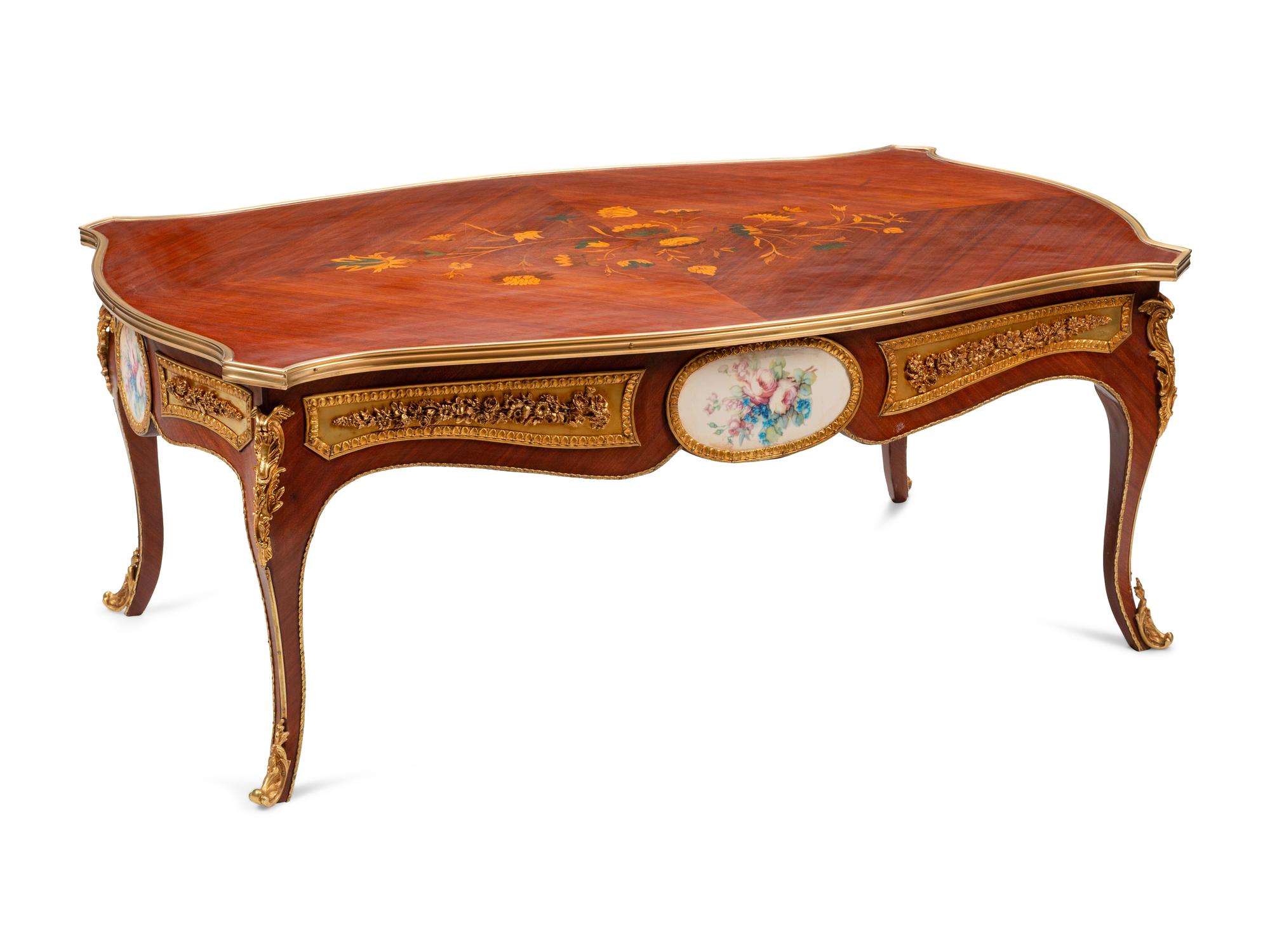 A Louis XV Style Gilt Bronze and Porcelain Mounted Marquetry Low Table