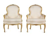 A Pair of Louis XV Carved Giltwood Bergères