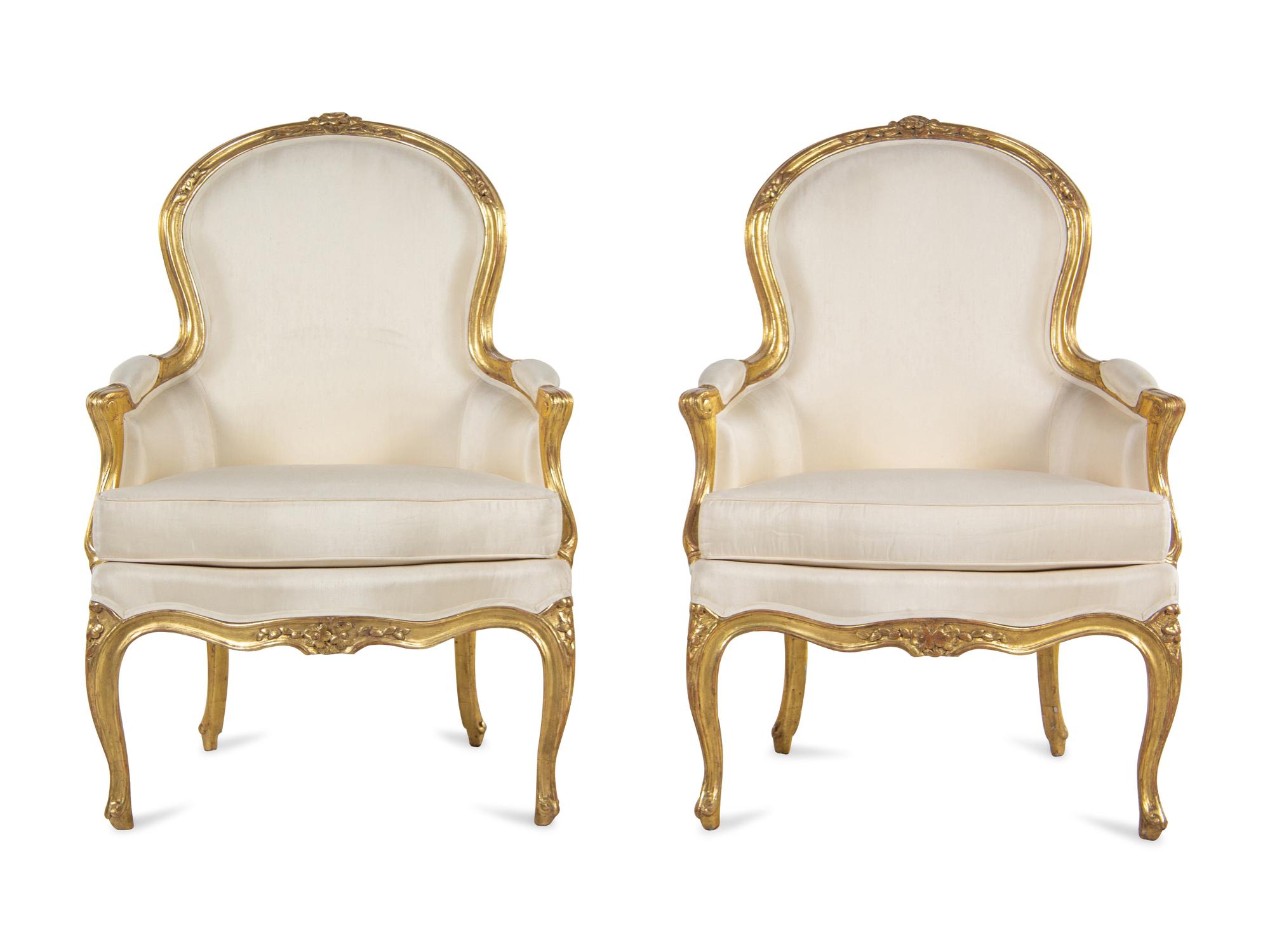 A Pair of Louis XV Carved Giltwood Bergères
