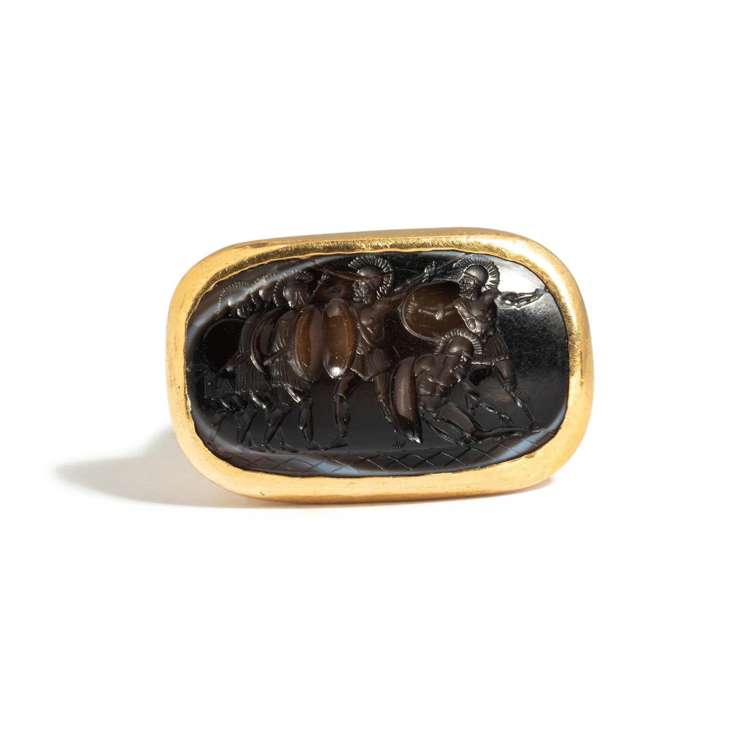 A Roman Agate Ring Stone with Six Hoplites Battling — Set in a gold ring