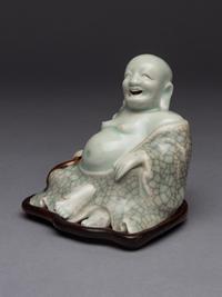 A Qingbai Glazed Porcelain Figure of Budhai Buddha