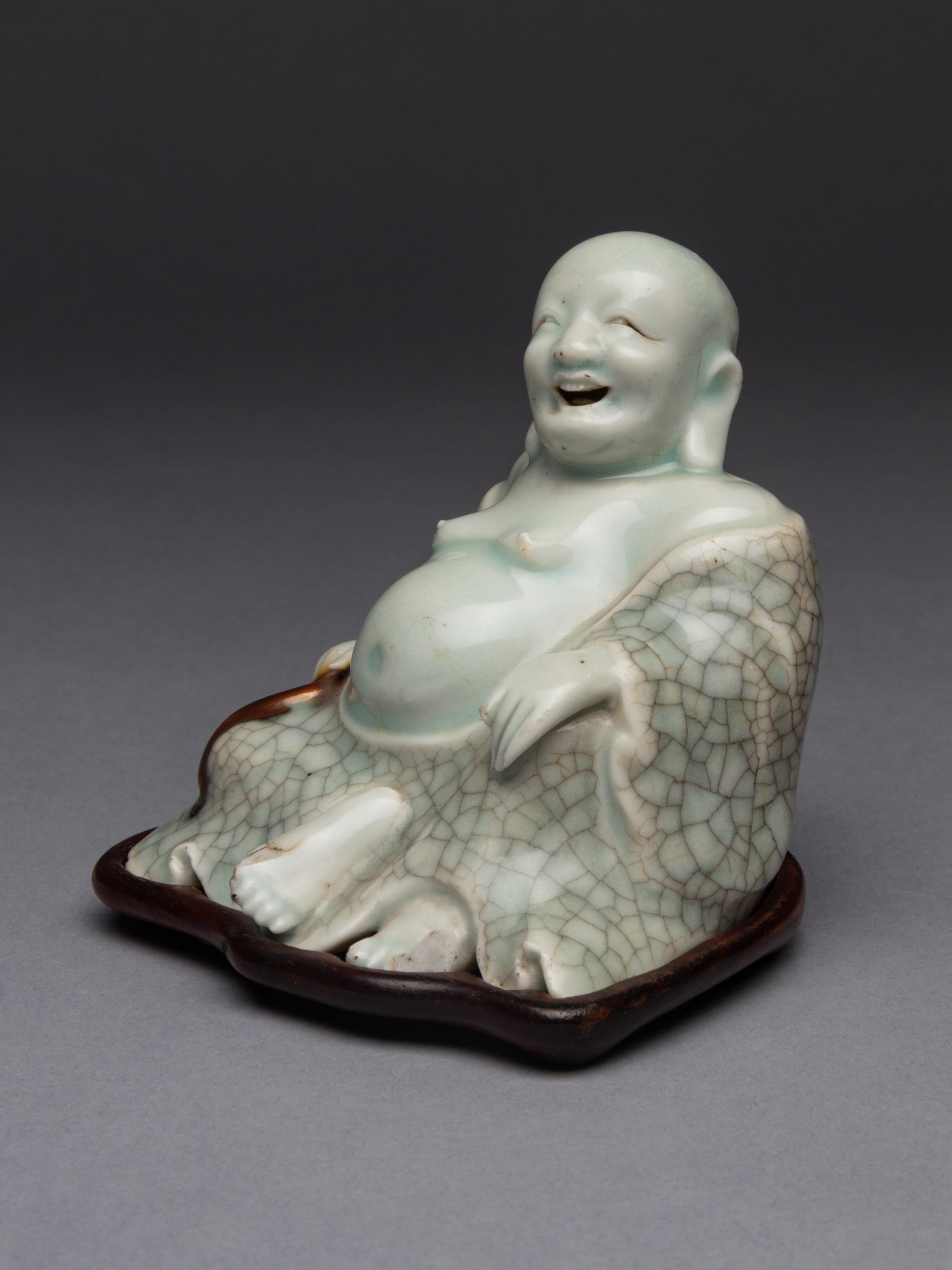 A Qingbai Glazed Porcelain Figure of Budhai Buddha