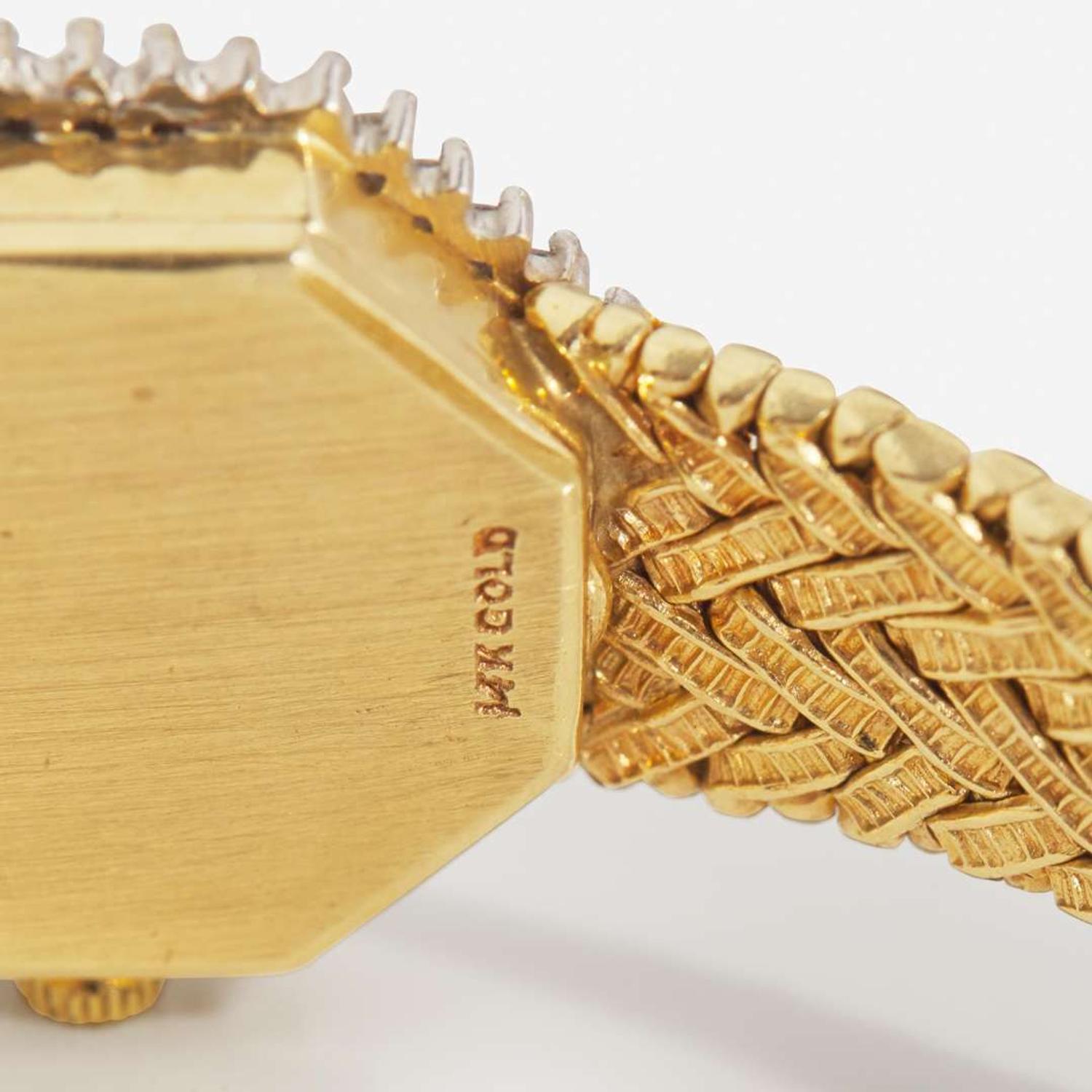 A Ladies 14K Yellow Gold and Diamond Watch
