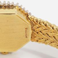 A Ladies 14K Yellow Gold and Diamond Watch