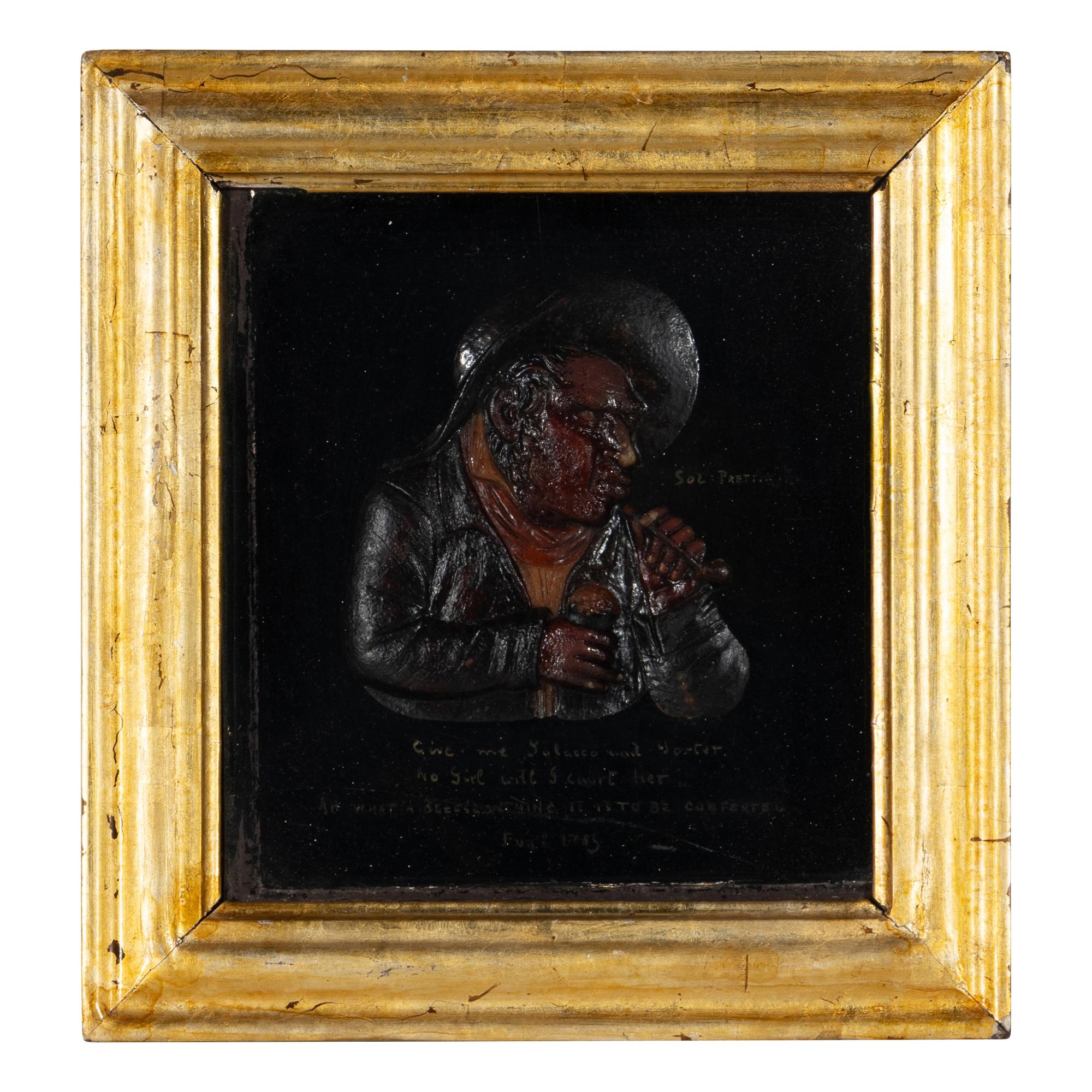 A Pair of Tobacco Themed Wax Portrait Profiles