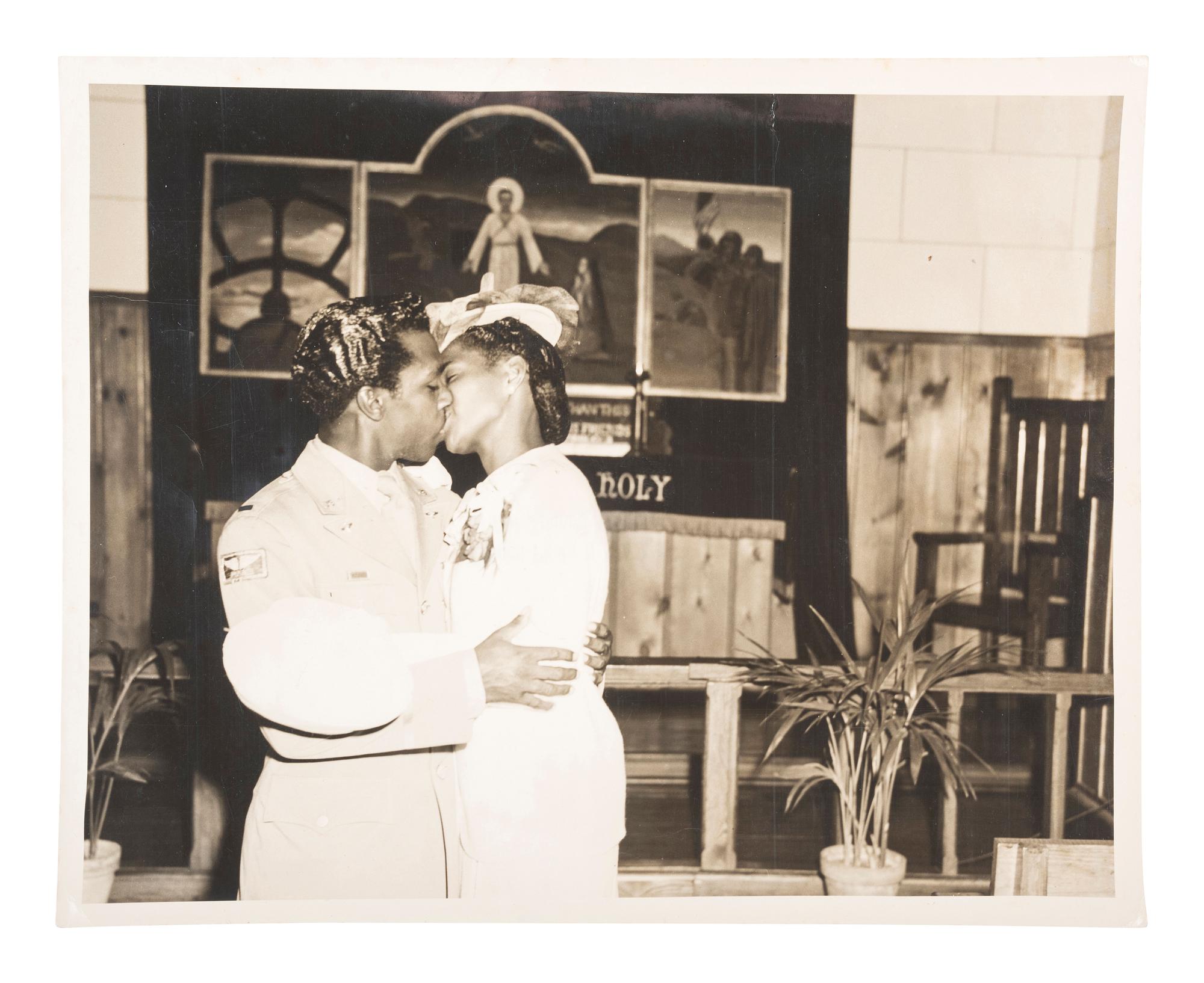 [AFRICAN AMERICANA - WORLD WAR II]. Photograph capturing the wedding ceremony of Tuskegee Airman Lt. Rual Bell, who had to parachute from an airplane after experiencing engine trouble over Yugoslavia, evading capture for nine days.