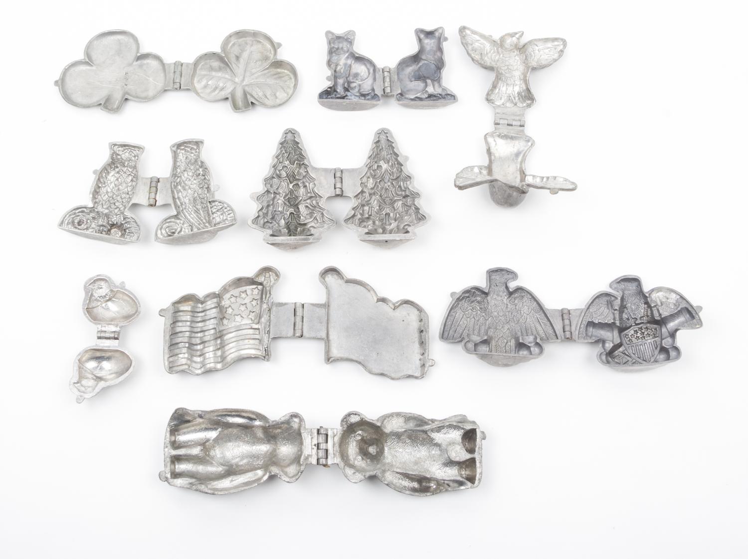 A Group of Pewter Ice Cream Molds Length of longest 6 inches.
