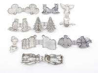 A Group of Pewter Ice Cream Molds Length of longest 6 inches.
