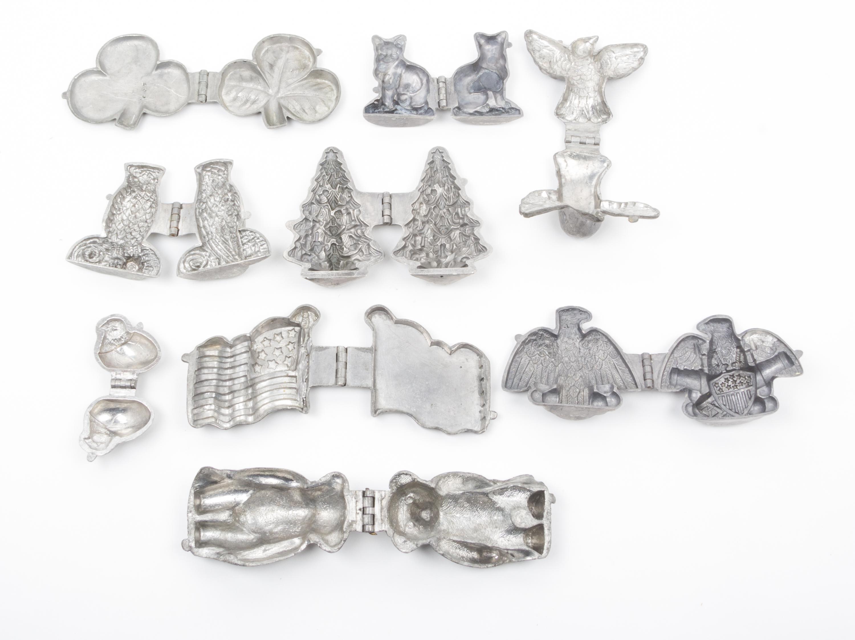 A Group of Pewter Ice Cream Molds Length of longest 6 inches.