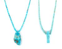 Two Carved Turquoise Pendants Length of larger 18 inches