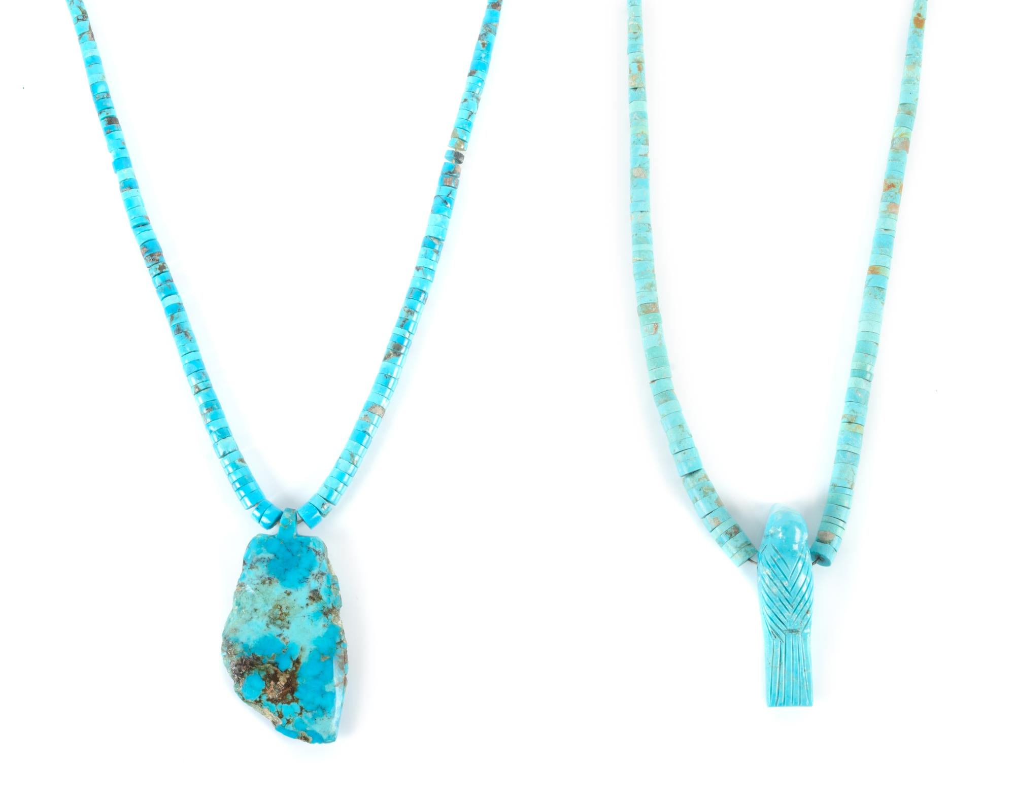 Two Carved Turquoise Pendants Length of larger 18 inches