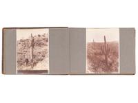 [NATIVE AMERICANS]. JONES, John Edward (1863-1922), photographer. Album containing 50 photographs of the San Carlos Indian Agency, including Apache civilians and police, agency buildings and dwellings, and scenic views. Ca 1904.