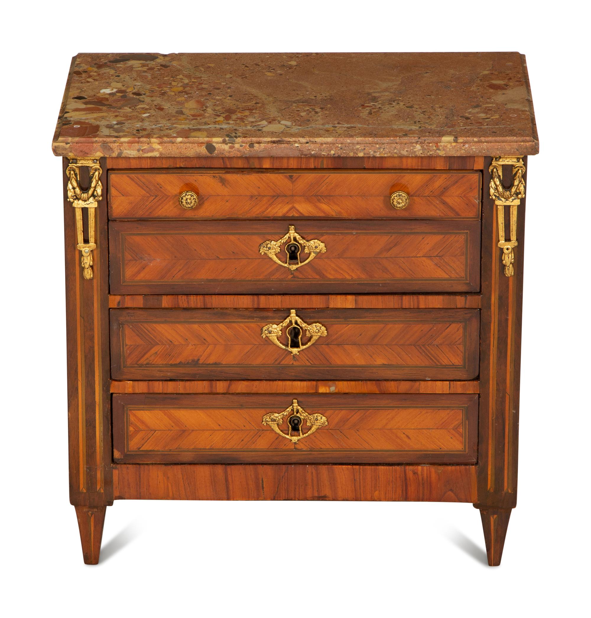 A Louis XVI Diminutive Marble-Top Four Drawer Chiffonier