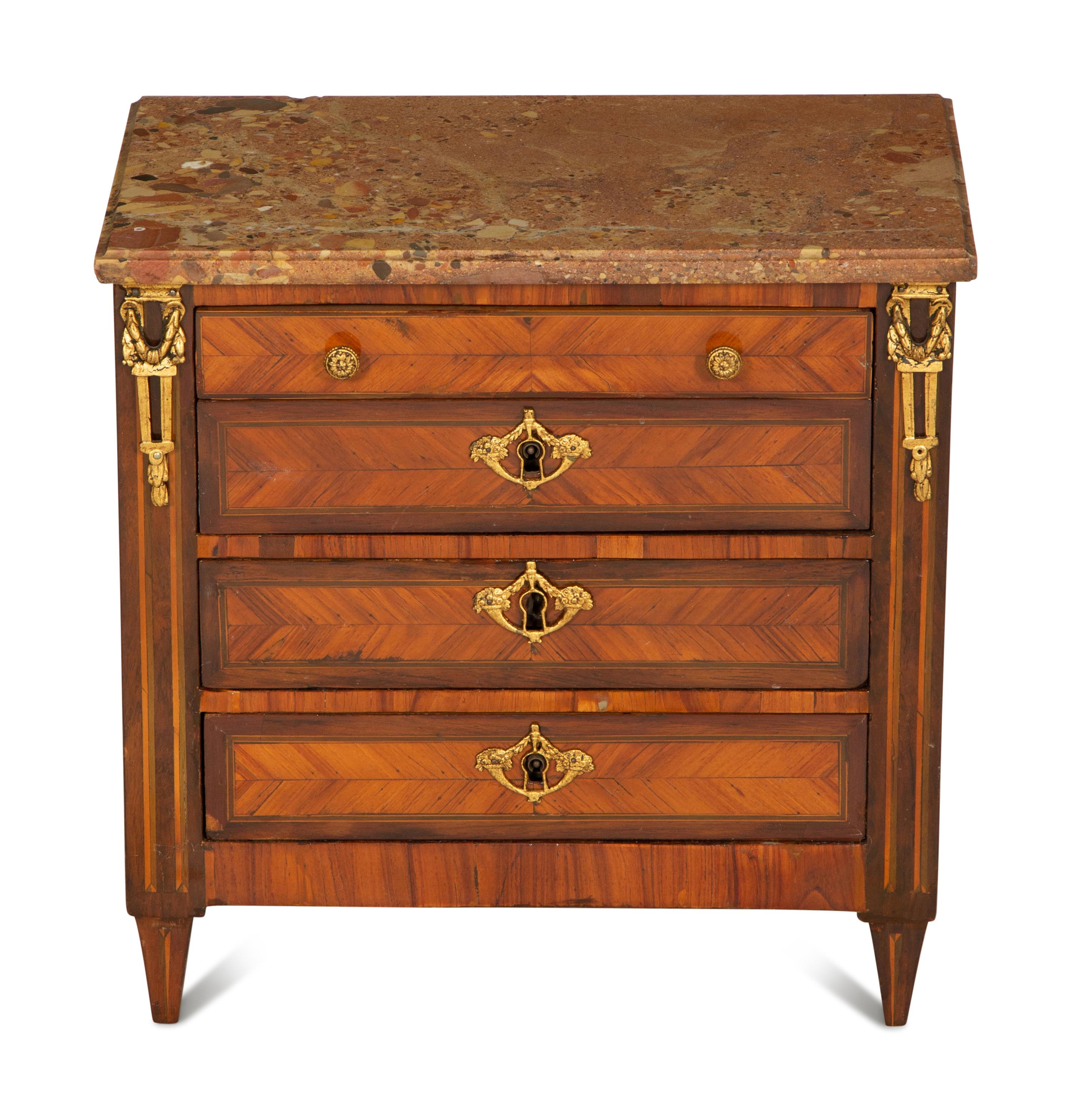 A Louis XVI Diminutive Marble-Top Four Drawer Chiffonier