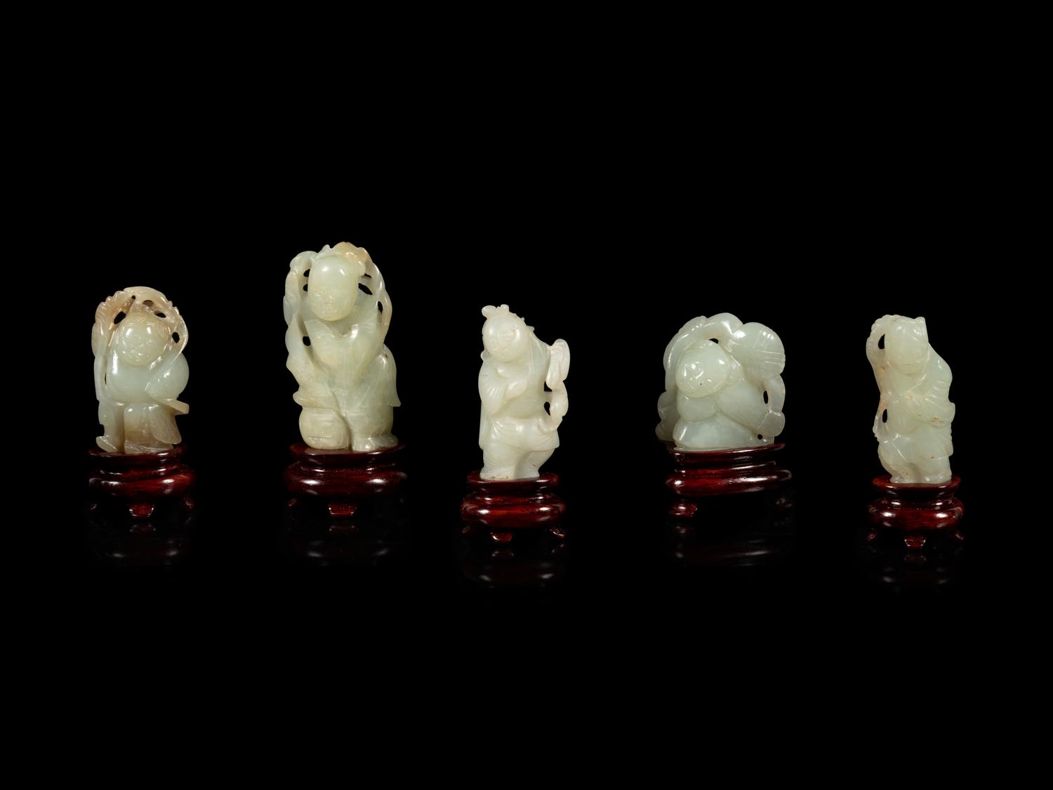 Eight Chinese Celadon Jade Figures of Boys