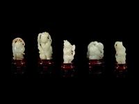 Eight Chinese Celadon Jade Figures of Boys