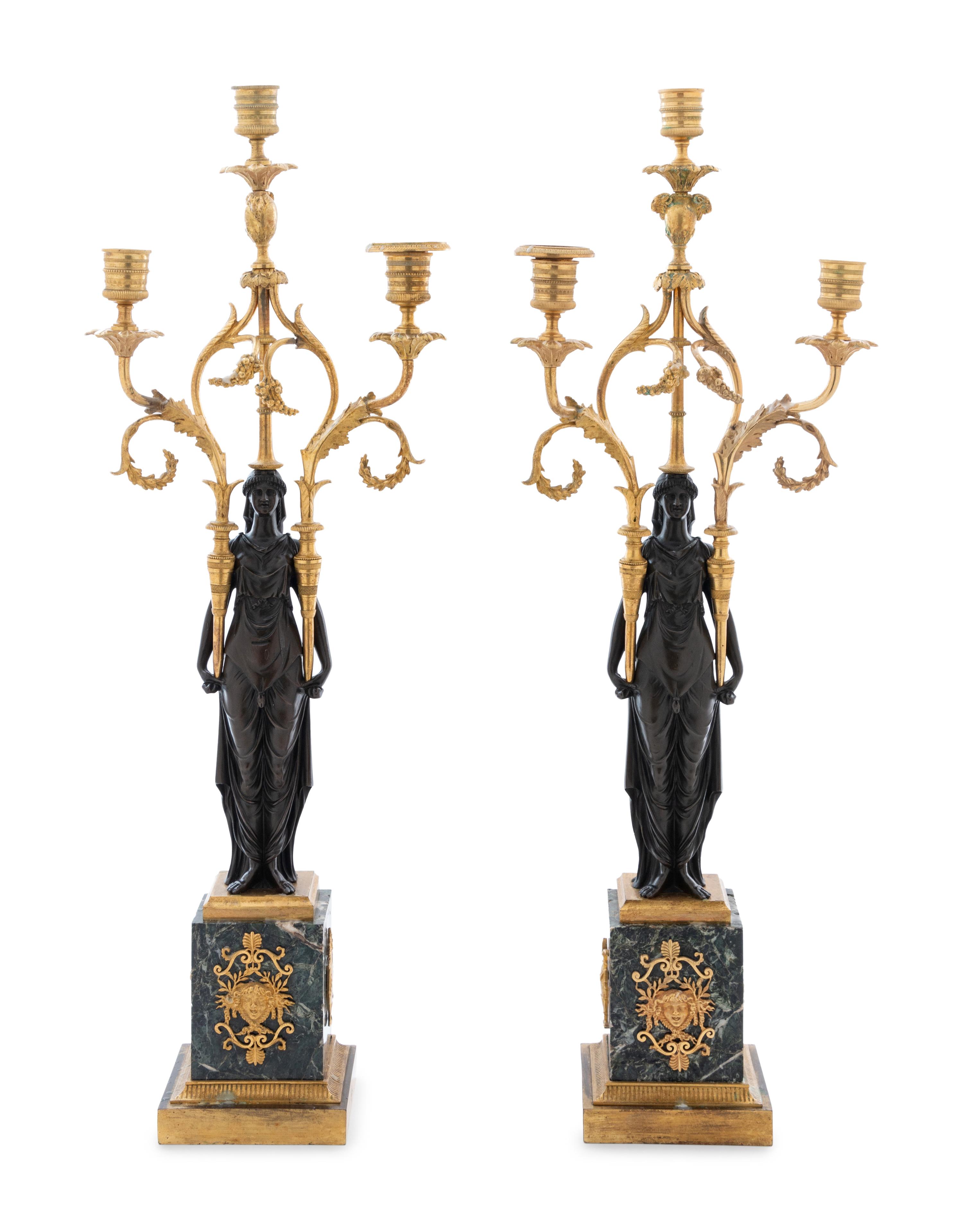 A Pair of Empire Gilt and Patinated Bronze and Marble Three-Light Figural Candelabra