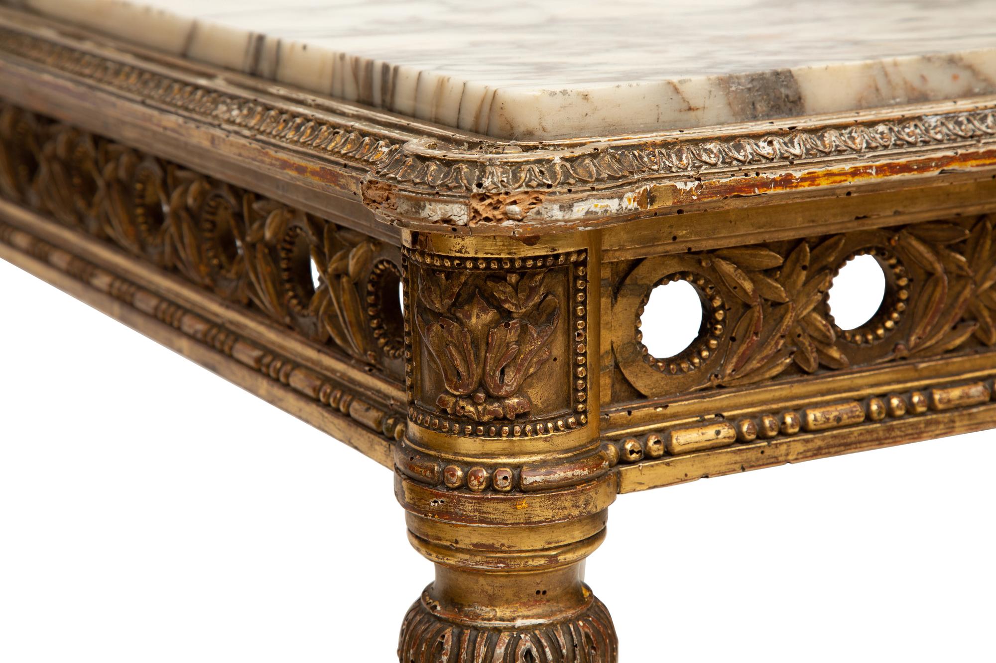 A Louis XVI Style Marble Top Giltwood Center Table
