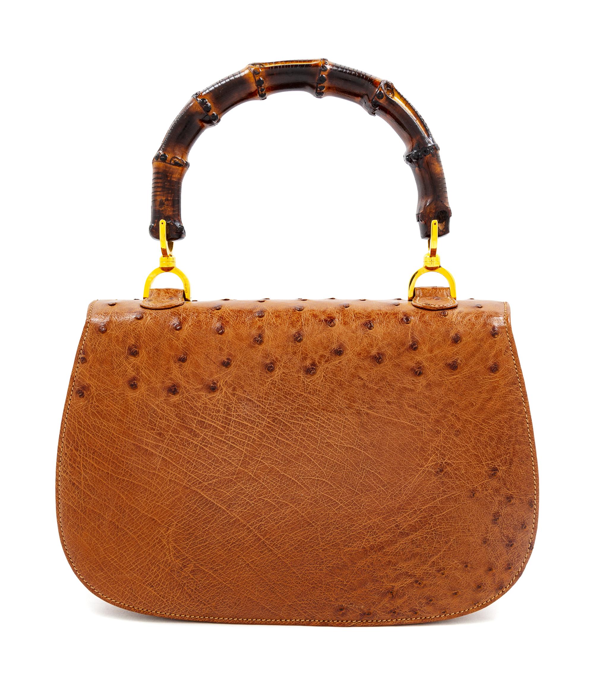 A Gucci Brown Ostrich Bamboo Top Handle Handbag, 7" H x 10.5" W x 2.5" D; Handle drop: 4.5".
