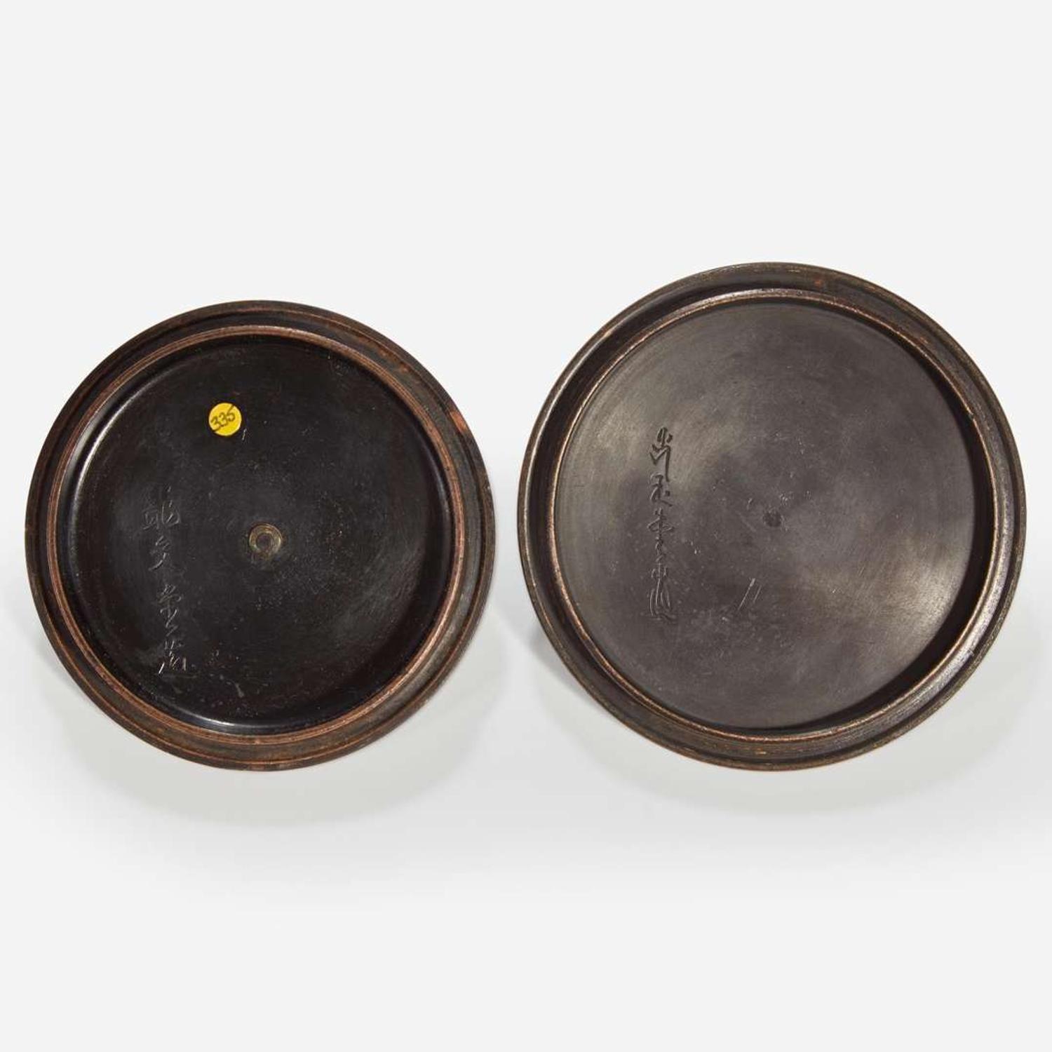 Two Japanese iron tetsubin with patinated bronze covers