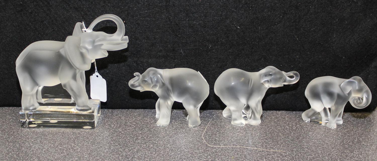 A Collection of Four Lalique Glass Elephant Figures Height of tallest 6 inches.