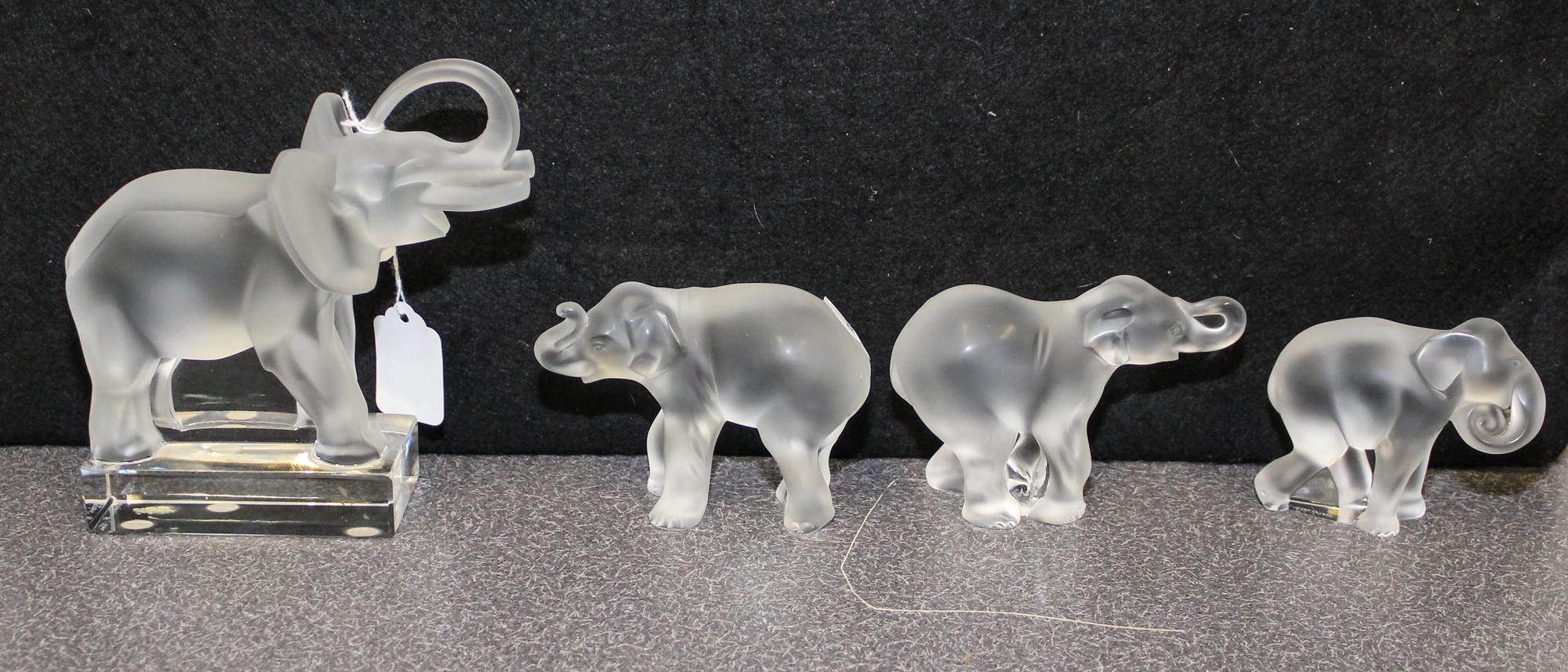 A Collection of Four Lalique Glass Elephant Figures Height of tallest 6 inches.