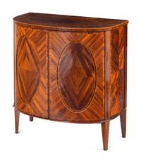A Pair of George III Goncalo Alves Demilune Cabinets