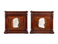 A Pair of Italian Carved Walnut Panels with Marble Profile Plaques